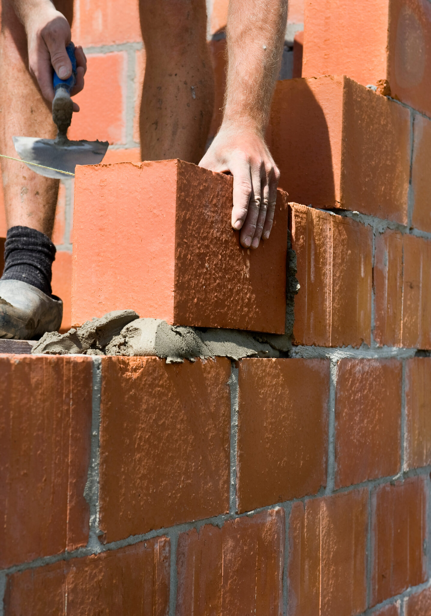 construction worker building a wall